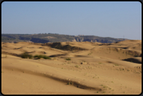 Blick von den Sanddnen zum normalen Land